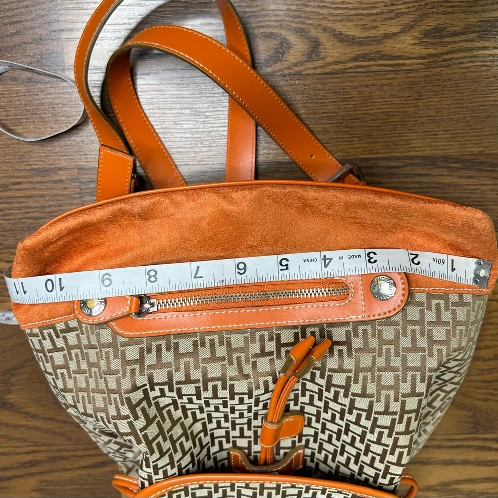 Tommy Hilfiger backpack in orange and brown with a monogram logo print